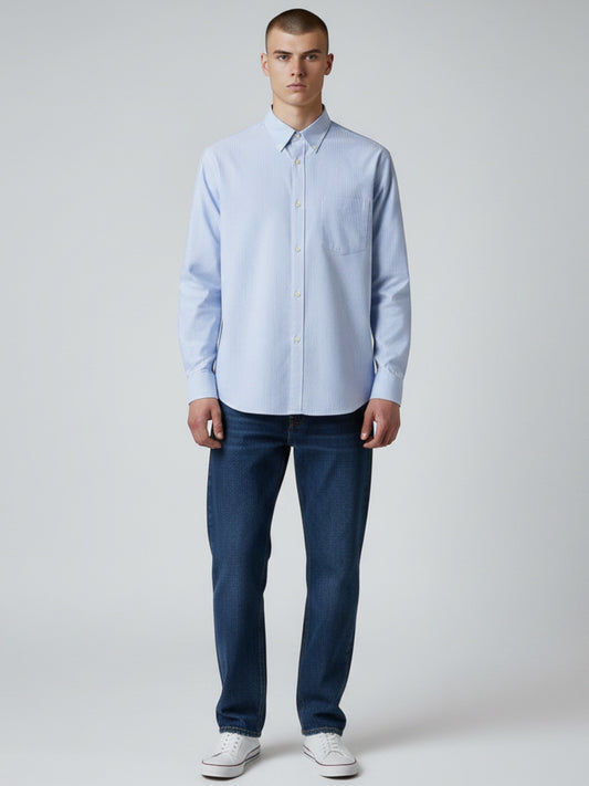 Manuel Store light blue and white striped Oxford cotton shirt with button-down collar, chest pocket, and button cuffs.