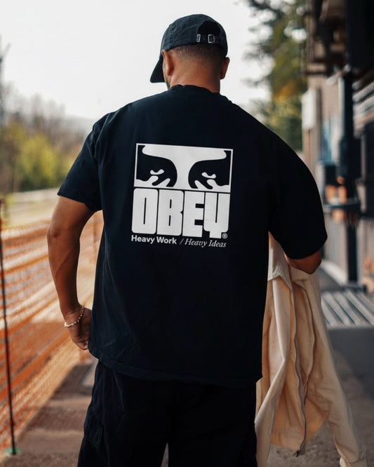 Manuel Store black 100% cotton heavyweight t-shirt with OBEY graphic on front and back.
