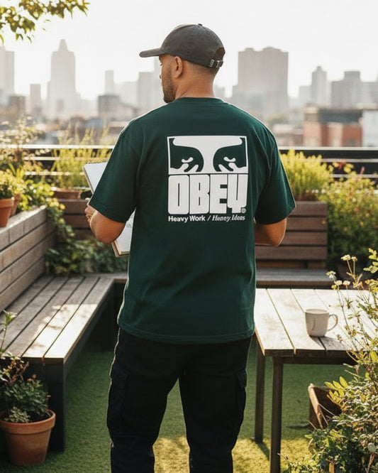 Manuel Store black 100% cotton heavyweight t-shirt with OBEY graphic print on back.