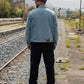 Manuel Store light wash denim trucker jacket with adjustable back tabs and OBEY leather patch.