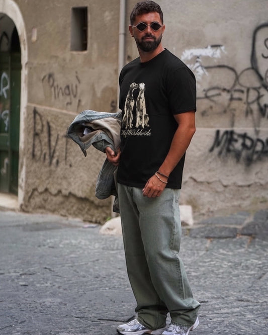 Manuel Store black 100% cotton t-shirt with two Dalmatians and "HUF Worldwide" graphic.