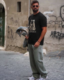 Manuel Store black 100% cotton t-shirt with two Dalmatians and "HUF Worldwide" graphic.