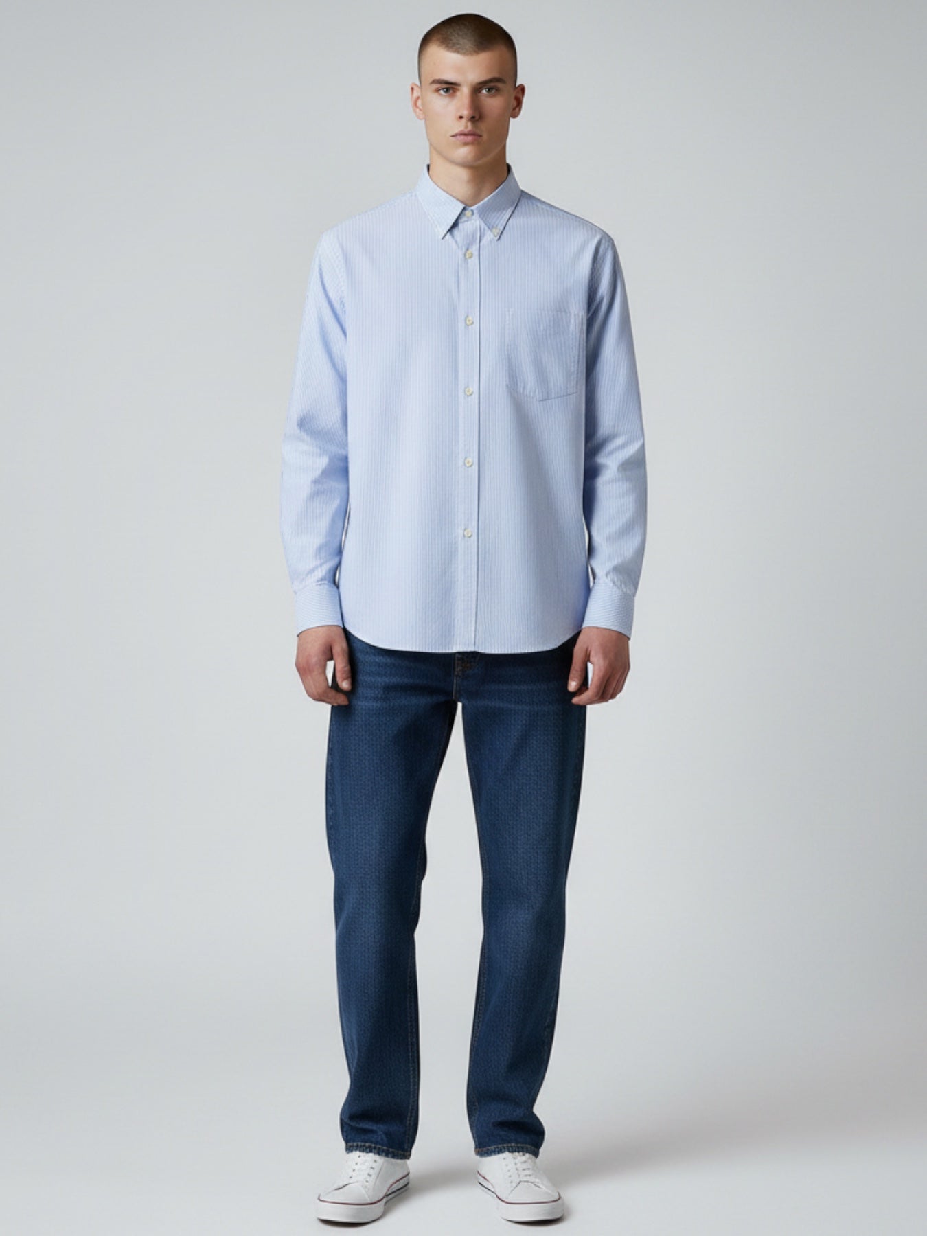 Manuel Store light blue and white striped Oxford cotton shirt with button-down collar, chest pocket, and button cuffs.