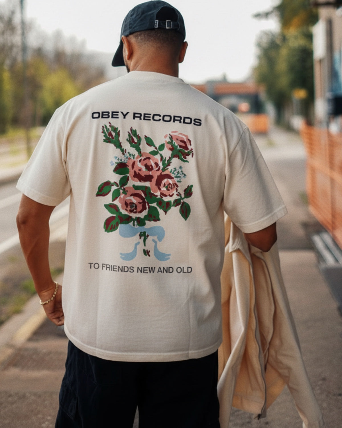 Manuel Store cream heavyweight 100% cotton t-shirt with floral graphic and "TO FRIENDS NEW AND OLD" text.