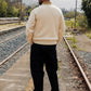 Manuel Store cream textured knit polo shirt with contrast tan collar and ribbed cuffs and hem.
