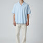 Manuel Store light blue short-sleeve resort collar shirt in organic cotton and TENCEL™ Modal blend with button closure.