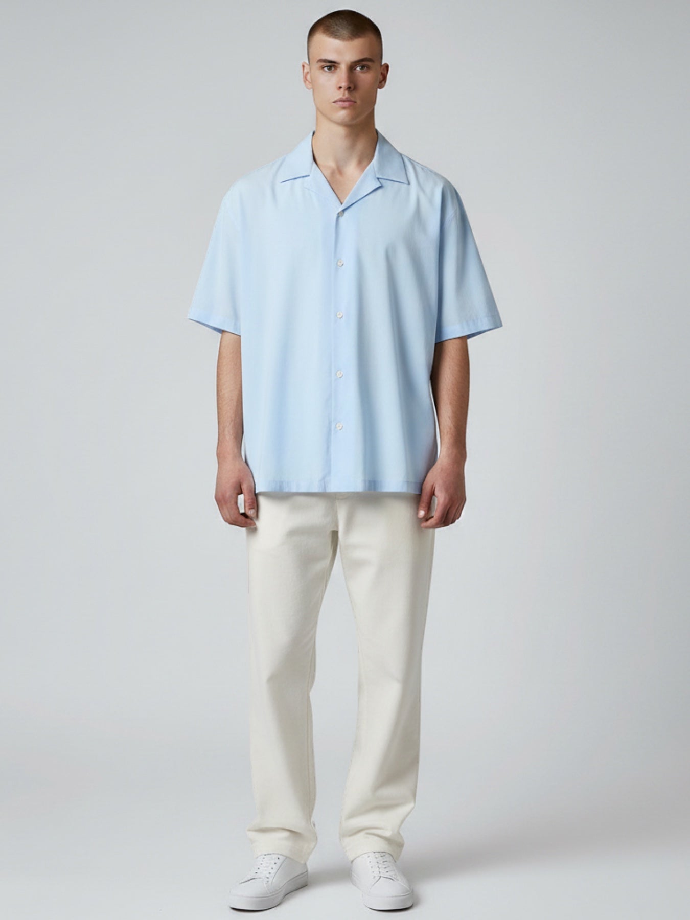Manuel Store light blue short-sleeve resort collar shirt in organic cotton and TENCEL™ Modal blend with button closure.
