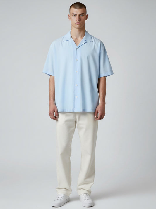 Manuel Store light blue short-sleeve resort collar shirt in organic cotton and TENCEL™ Modal blend with button closure.