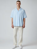 Manuel Store light blue short-sleeve resort collar shirt in organic cotton and TENCEL™ Modal blend with button closure.