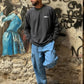 Manuel Store OBEY Studios pigment dyed charcoal grey 100% cotton long sleeve t-shirt with front and back graphic.