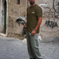 Manuel Store olive green 100% cotton relaxed fit t-shirt with white 'OBEY WORLDWIDE' graphic on front and back.