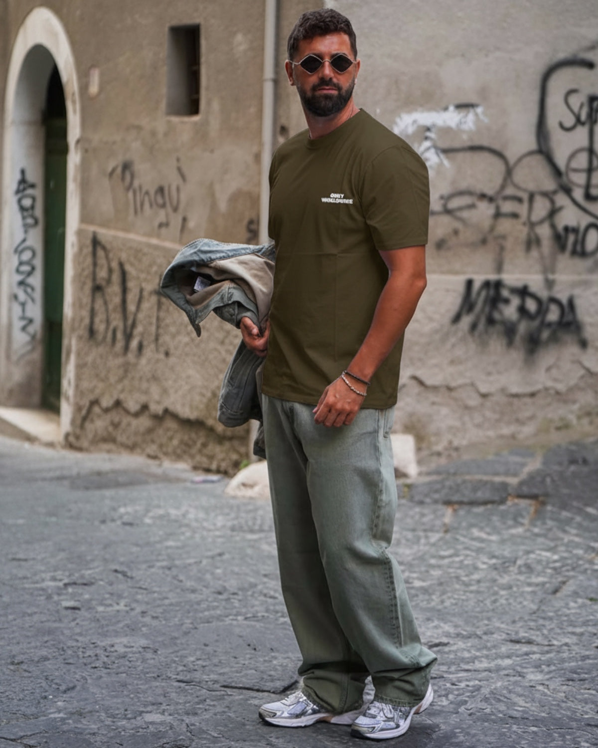 Manuel Store olive green 100% cotton relaxed fit t-shirt with white 'OBEY WORLDWIDE' graphic on front and back.