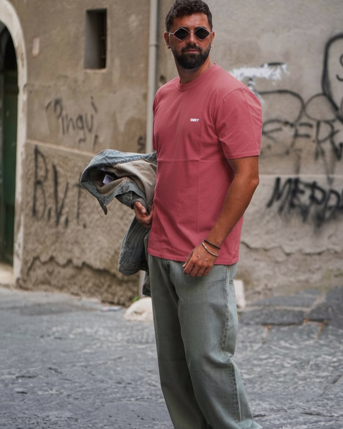 Manuel Store red cotton t-shirt with small white OBEY logo on chest and back graphic print.