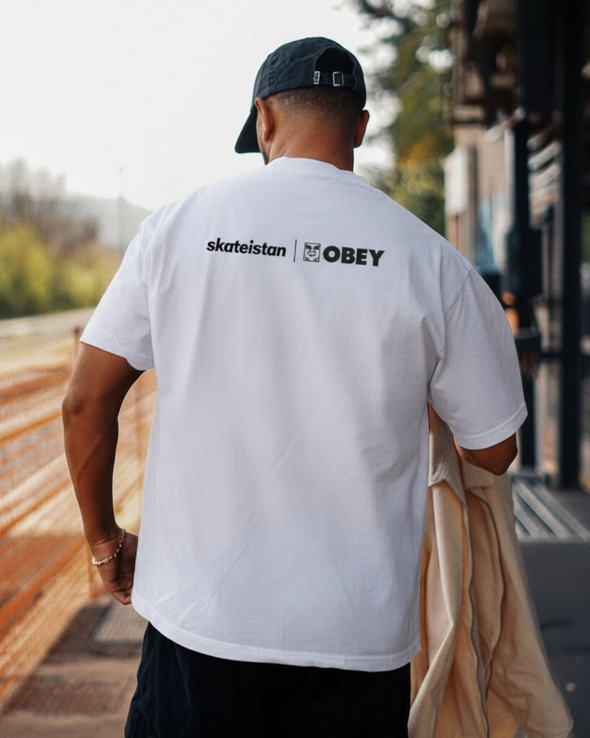 Manuel Store white 100% cotton classic fit t-shirt with Skateistan and OBEY graphic print on front and back.