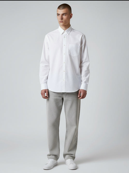 Manuel Store white cotton Oxford shirt with button-down collar, chest pocket, and button cuffs. Relaxed fit.
