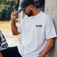 Manuel Store white 100% cotton classic fit t-shirt with OBEY STUDIOS graphic print on front and back.