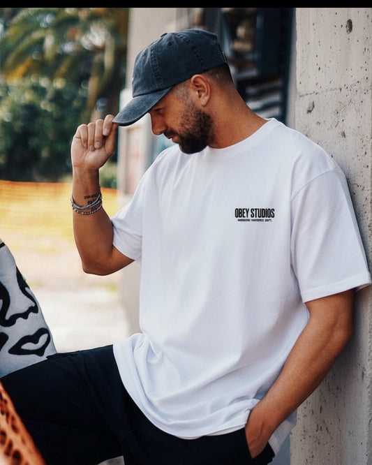 Manuel Store white 100% cotton classic fit t-shirt with OBEY STUDIOS graphic print on front and back.