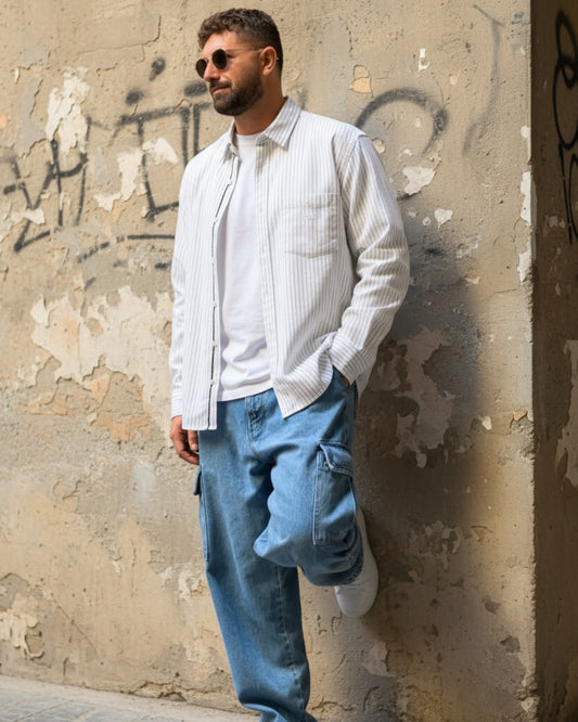 Manuel Store white cotton-linen blend striped long sleeve shirt with chest pocket and scallop hem.